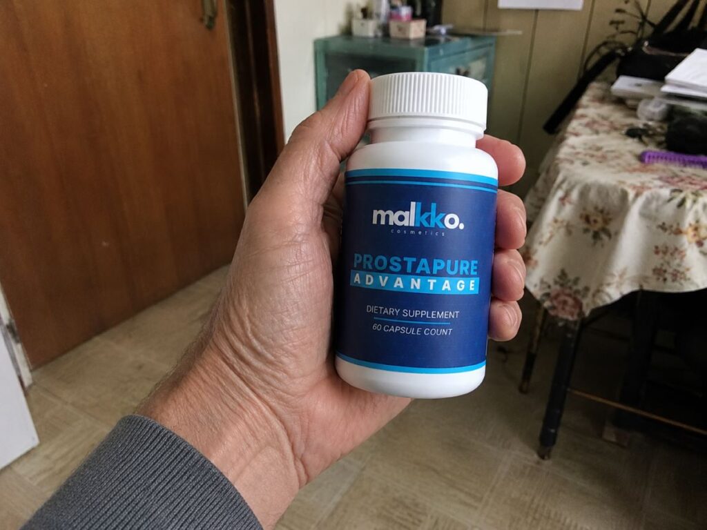 ProstaPure Advantage bottle held in hand