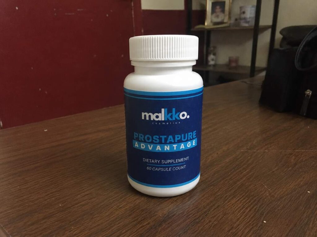 ProstaPure Advantage bottle on a wooden table — front label view